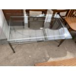 A MODERN GLASS TOP COFFEE TABLE ON METALWARE BASE, 39X24"