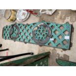 A DECORATIVE CAST IRON BENCH BACK