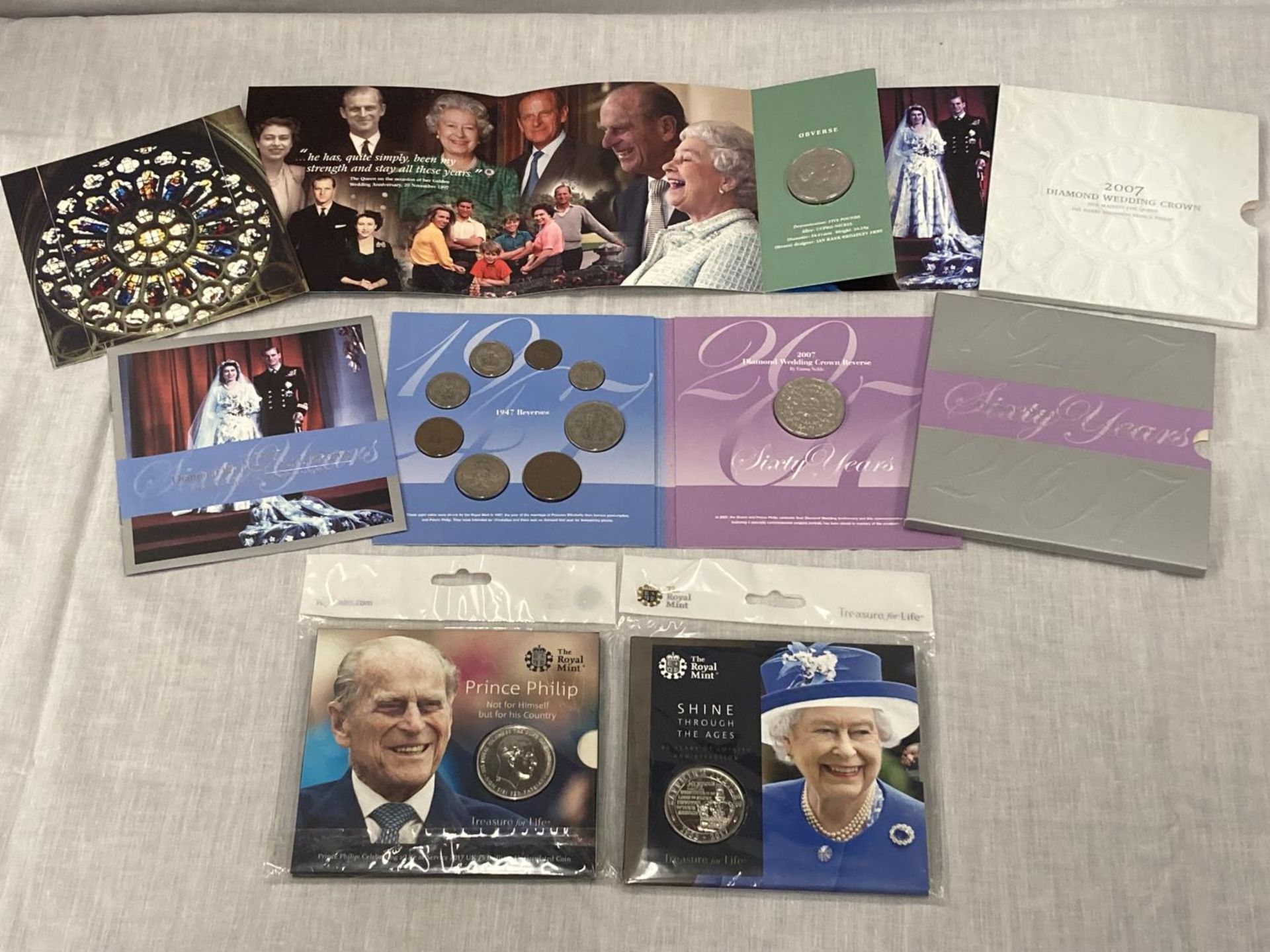 A SELECTION OF FOUR ROYAL MINT COIN PACKS
