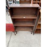 AN OPEN MAHOGANY THREE TIER BOOKCASE