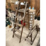 A VINTAGE WOODEN FOUR RUNG STEP LADDER