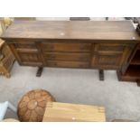 AN OAK 'OLD CHARM' SIDEBOARD WITH LINENFOLD DOORS, 64" WIDE