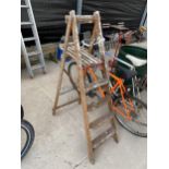 A VINTAGE FOUR RUNG WOODEN STEP LADDER