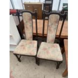 A PAIR OF ERCOL DINING CHAIRS ON TURNED LEGS AND UPRIGHTS