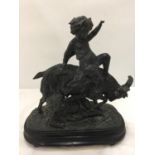 A METAL FIGURE OF A CHILD RIDING A GOAT HEIGHT 31CM, LENGTH 29CM