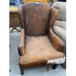 A MID 20TH CENTURY STUDDED LEATHER FIRESIDE CHAIR
