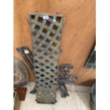 A PAIR OF DECORATIVE CAST IRON BENCH ENDS AND A CAST IRON LATTICE BENCH BACK