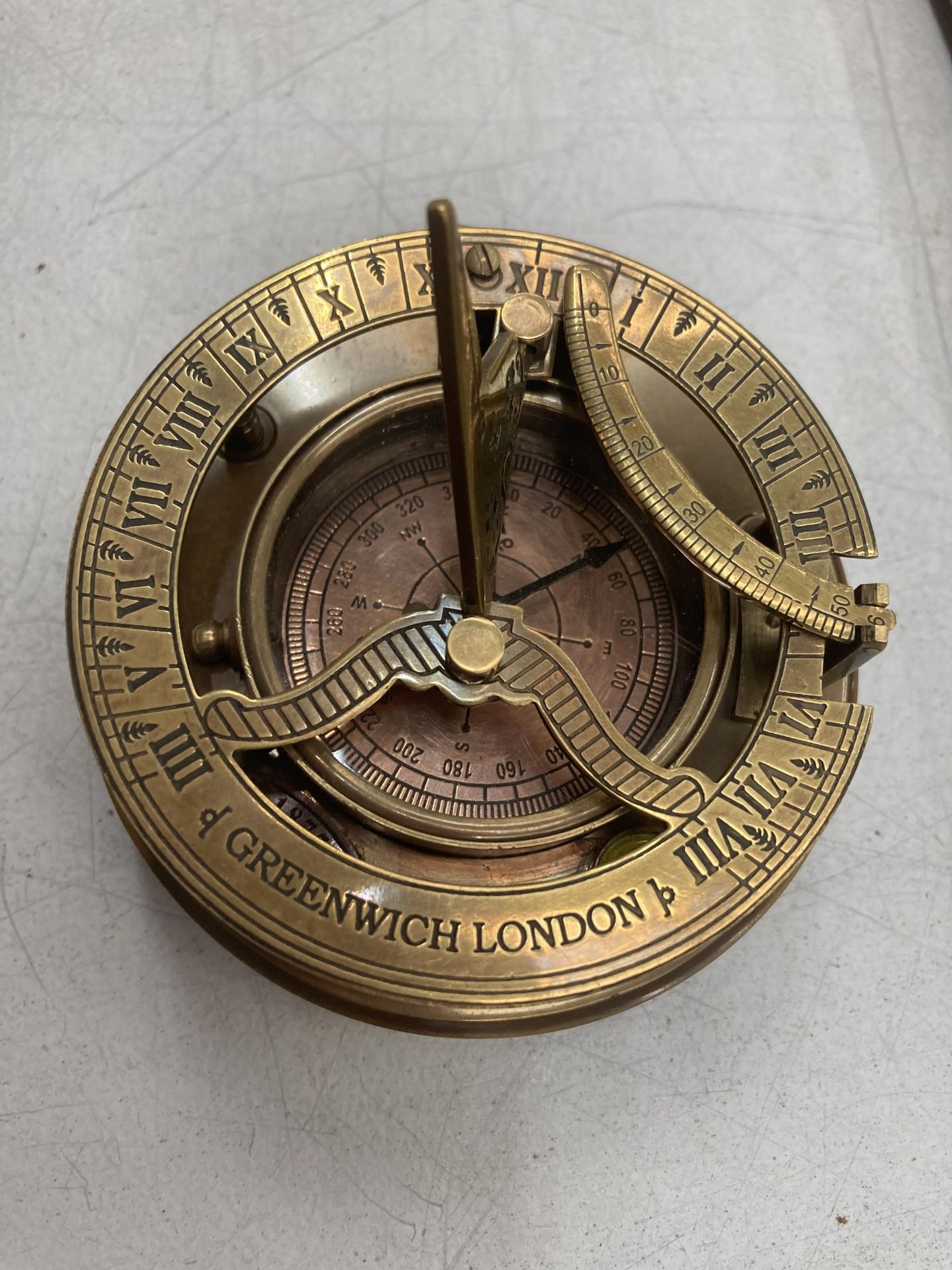 A BRASS SUNDIAL GREENWICH LONDON COMPASS W: 8.5CM