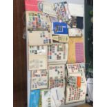 A LARGE COLLECTION OF STAMPS TO INCLUDE SEVERAL WORLD ALBUMS, SOME FIRST DAY COVERS AND LOOSE STAMPS