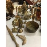 A QUANTITY OF BRASSWARE TO INCLUDE TWO ASIAN STYLE KNIVES IN SCABBARDS, CANDLESTICKS, TRIVET,