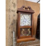 A WOODEN VIENNA STYLE WALL CLOCK