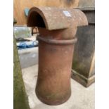 A DECORATIVE TERRACOTTA CHIMNEY POT