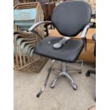 A MODERN CHROME FRAMED BARBERS TYPE CHAIR WITH SWEPT ARMS AND FAUX LEATHER SEAT AND BACK