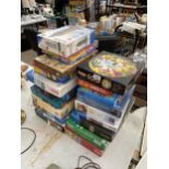 A LARGE ASSORTMENT OF JIGSAW PUZZLES