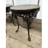 A CAST IRON PUB TABLE WITH BEATEN COPPER TOP, 23" DIAMETER