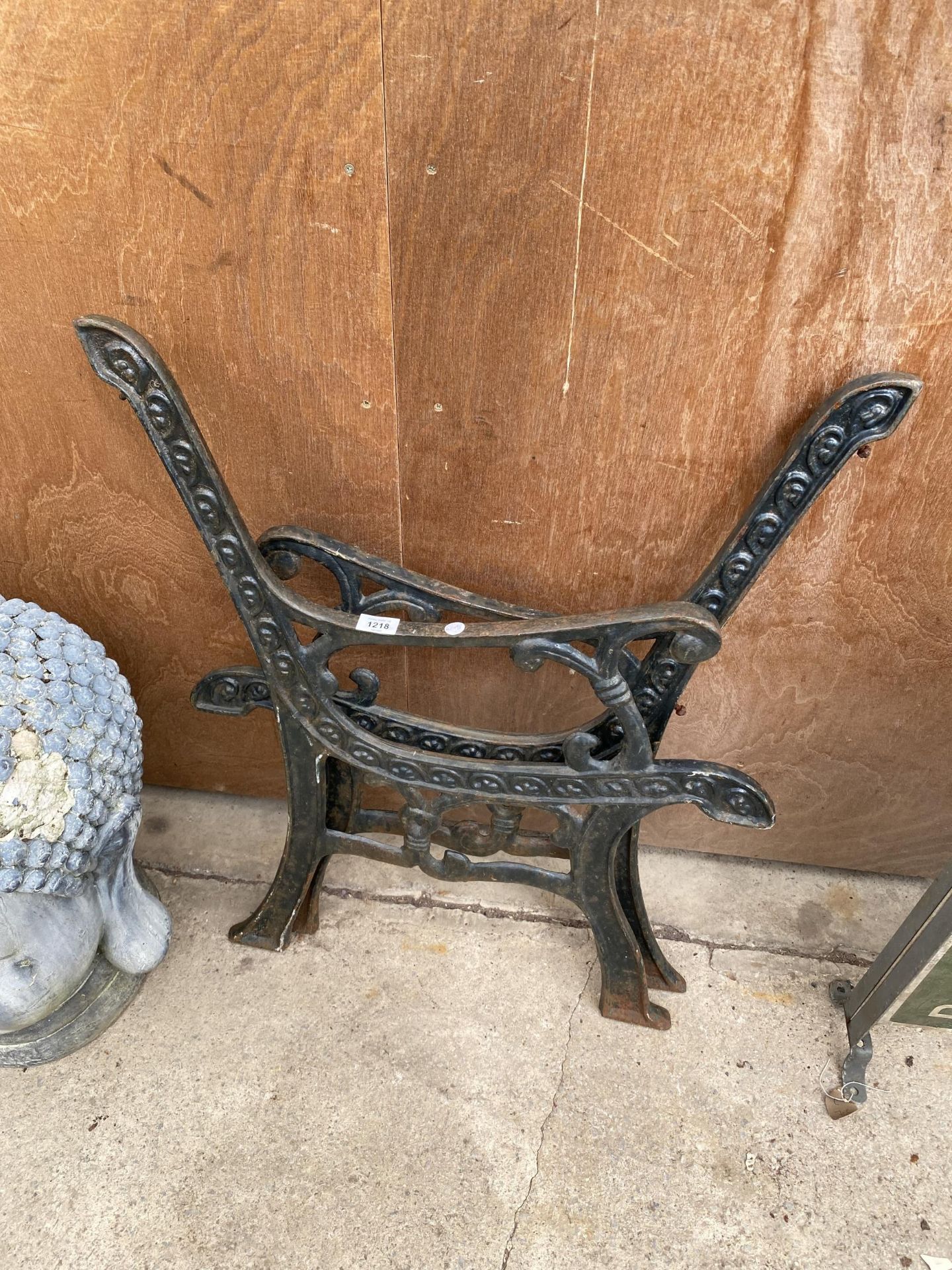 A PAIR OF DECORATIVE CAST IRON BENCH ENDS