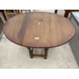 A MINIATURE OAK 'OLD CHARM' GATELEG TABLE