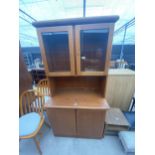 A MID 20TH CENTURY RETRO TEAK TWO DOOR BOOKCASE ON BASE, 37" WIDE, BEARING 'MADE IN DENMARK' STAMP