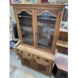 A LATE VICTORIAN BOOKCASE ON BASE