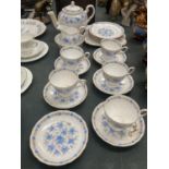 A TUSCAN CHINA 'LOVE IN THE MIST' TEASET TO INCLUDE TEAPOT, CUPS, SAUCERS, PLATES, CREAM JUG AND