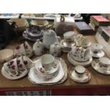 A QUANTITY OF CHINA CUPS, SAUCERS, PLATES, TEAPOT, PRESERVE POTS, ETC