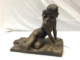 A BRONZED CERAMIC FIGURE OF A NUDE LADY ON A BASE SIGNED AWLSON 32/50 H: 34CM