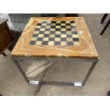 A MODERN ONYX EFFECT 19.5" SQUARE GAMES TABLE ON POLISHED CHROME BASE