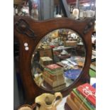 A VINTAGE OAK FRAMED ARTS AND CRAFTS BEVELLED GLASS MIRROR 65CM X 65CM