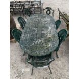 A CAST ALLOY BISTRO SET COMPRISING OF A LARGE OVAL TABLE AND 7 CHAIRS (4 OF ONE STYLE AND 3 OF