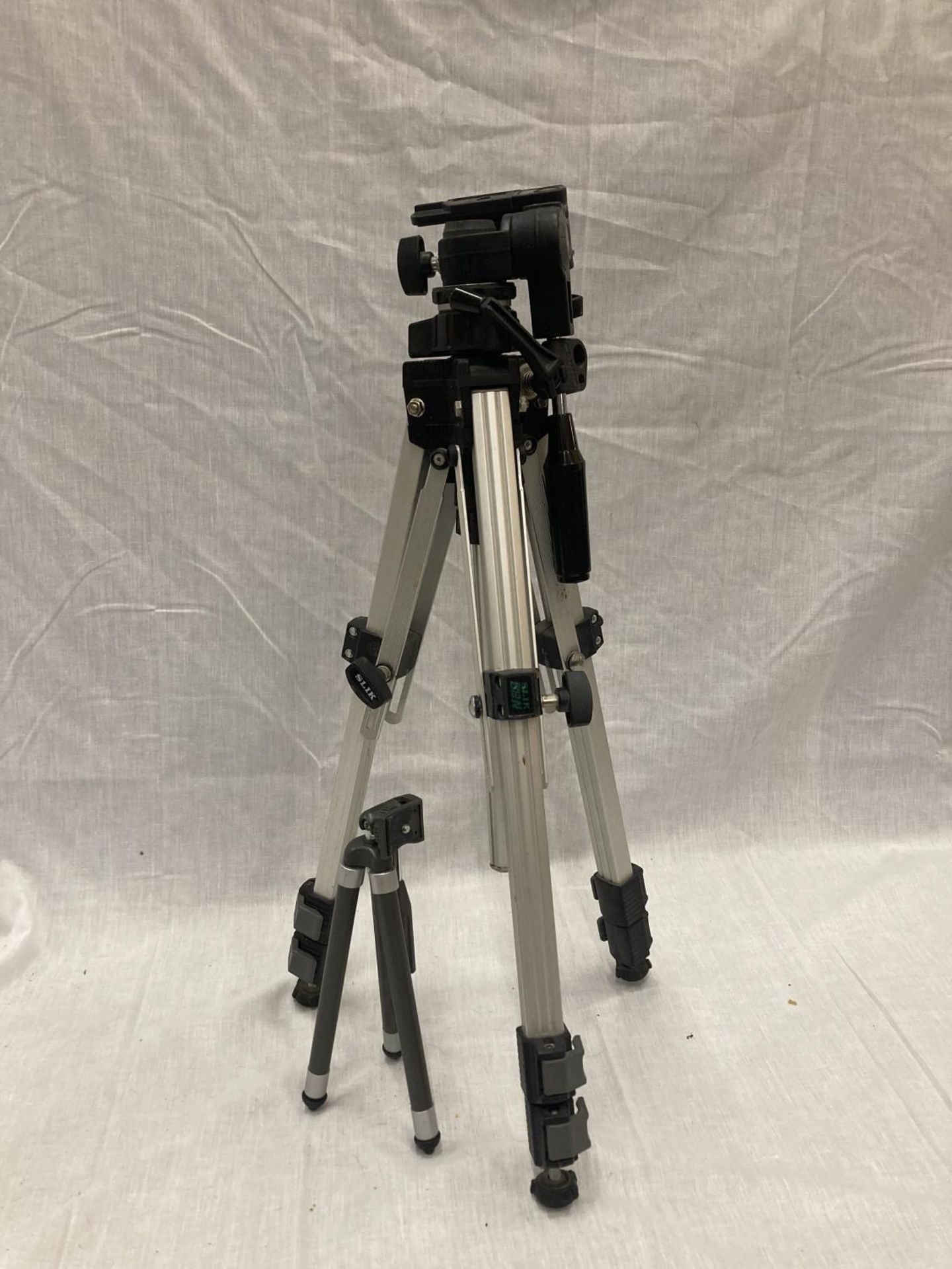 A LARGE 'SLIK 88N' ADJUSTABLE TRIPOD COMPLETE WITH SPIRIT LEVEL PLUS A SMALLER TRIPOD