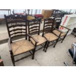 FOUR LANCASHIRE STYLE LADDERBACK DINING CHAIRS WITH RUSH SEATS, TWO BEING CARVERS