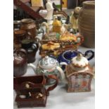 A COLLECTION OF NOVELTY TEAPOTS TO INCLUDE SADLER, ARTHUR WOOD, TONY WOOD, ETC, COTTAGES, CAMEL, ETC