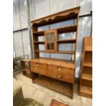 A VICTORIAN PINE DRESSER WITH TWO SHORT AND ONE LONG DRAWER WITH BRASS SCOOP HANDLES TO THE OPEN