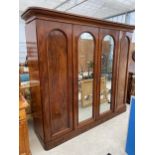 A VICTORIAN MAHOGANY FOUR DOOR WARDROBE, TWO BEING MIRRORED, 92" WIDE, WITH INTERNAL SLIDES AND