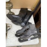 A PAIR OF VINTAGE ICE SKATES AND A PAIR OF RIDING BOOTS