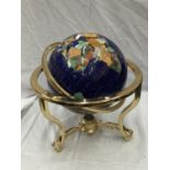A GLOBE WITH MOTHER OF PEARL INLAYS ON BRASS ROTATING STAND H: 45CM
