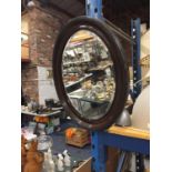 A VICTORIAN HARDWOOD OVAL BEVELLED MIRROR 61CM X 51CM