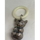 A SILVER RATTLE AND TEETHING RING