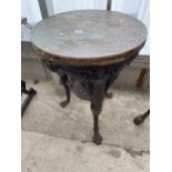 A CAST IRON PUB TABLE WITH BEATEN COPPER TOP, 23" DIAMETER