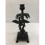 A CAST CANDLE HOLDER, THE BASE BEING A TREE WITH A BIRD HEIGHT 24CM