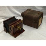 A 19TH CENTURY W.I. CHADWICK PATENT CAMERA IN A LEATHER CASE WITH MANCHESTER 2258 LENS ATTACHMENT