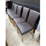 A SET OF SIX BROWN FAUX LEATHER DINING CHAIRS