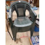 FOUR PLASTIC STACKING GARDEN CHAIRS