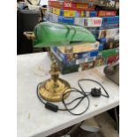 A BRASS BANKERS LAMP WITH GREEN GLASS SHADE