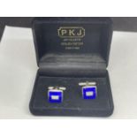 A PAIR OF SILVER CUFF LINKS IN A PRESENTATION BOX