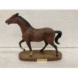 A BESWICK MATT BAY HORSE ON WOODEN PLINTH - "SPIRIT OF FIRE" - NOSE TO END OF TAIL - 25.5 CM -