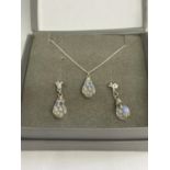 A BOXED SILVER NECKLACE AND EARRINGS SET