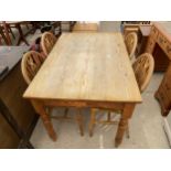 A PINE KITCHEN TABLE, 48X31" AND FOUR WHEELBACK CHAIRS