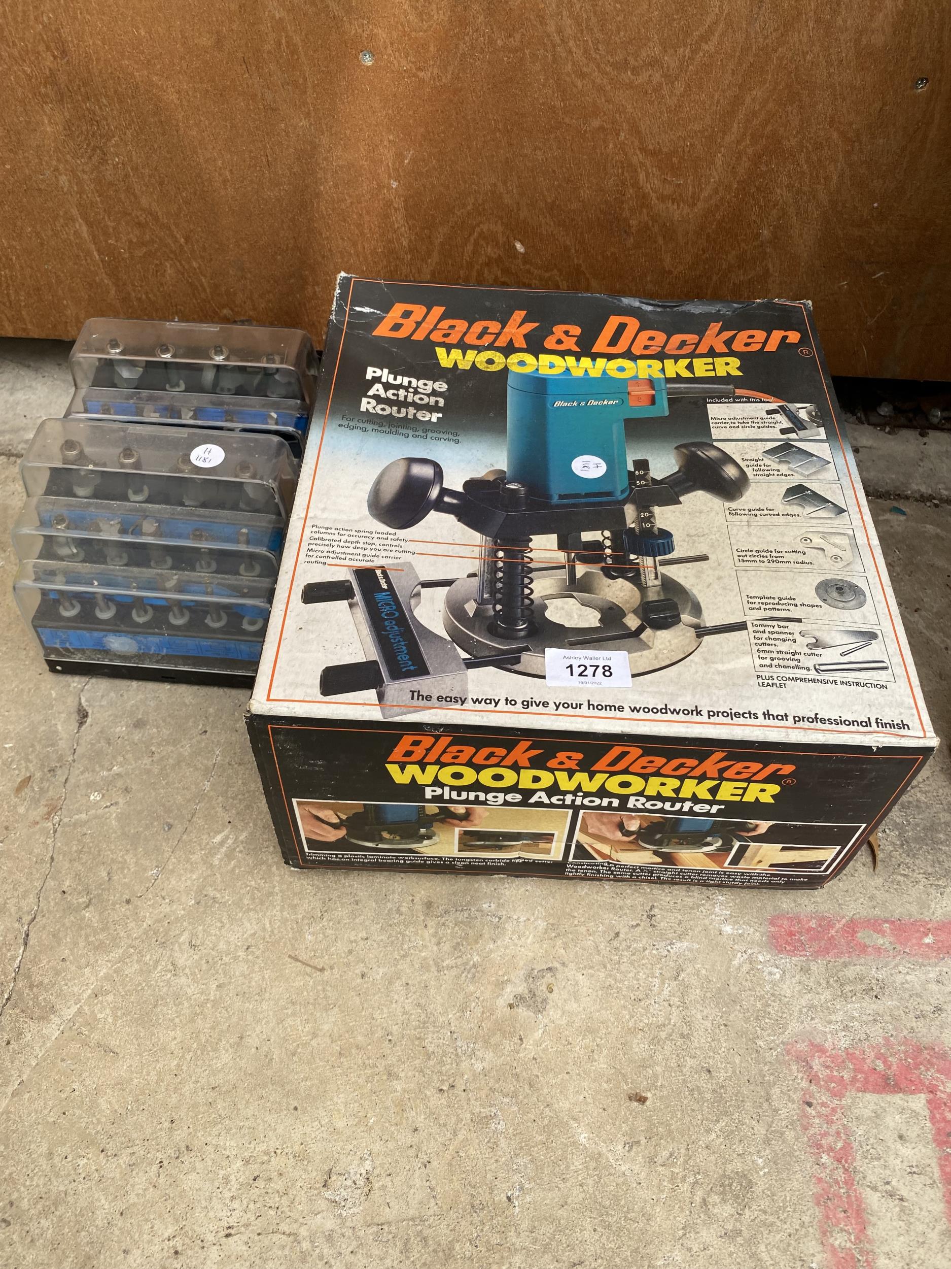 A BLACK AND DECKER WOOD WORKER ROUTER AND A COLLECTION OF ROUTER BITS