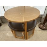 A MODERN 35.5" DIAMETER OAK TABLE AND FOUR TRIANGULAR SHAPED STOOLS